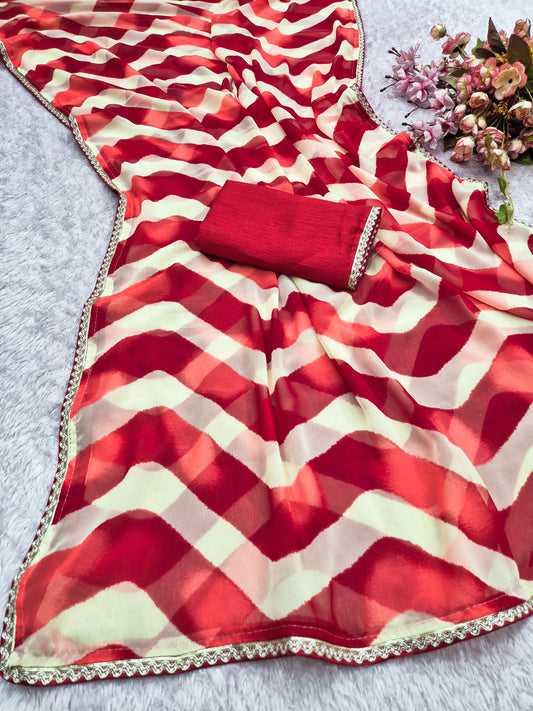 laheriya print georgette fabric with beads design lace border saree with heavy banglori silk blouse.