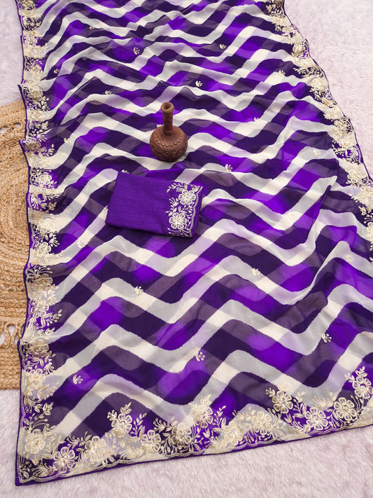 pitta embroidery work "C PALLU " design on laheriya print saree with embroidered blouse.