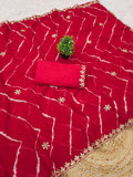 Laheriya print saree with beads embroidery work with embroidered blouse.